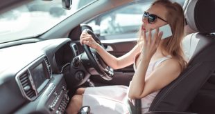 Woman driver on phone - GEM Motoring Assist